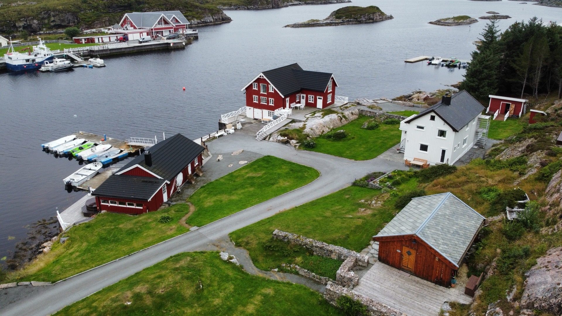 Aerial view of the property on Ekkilsøy — houses, boathouse and private quay