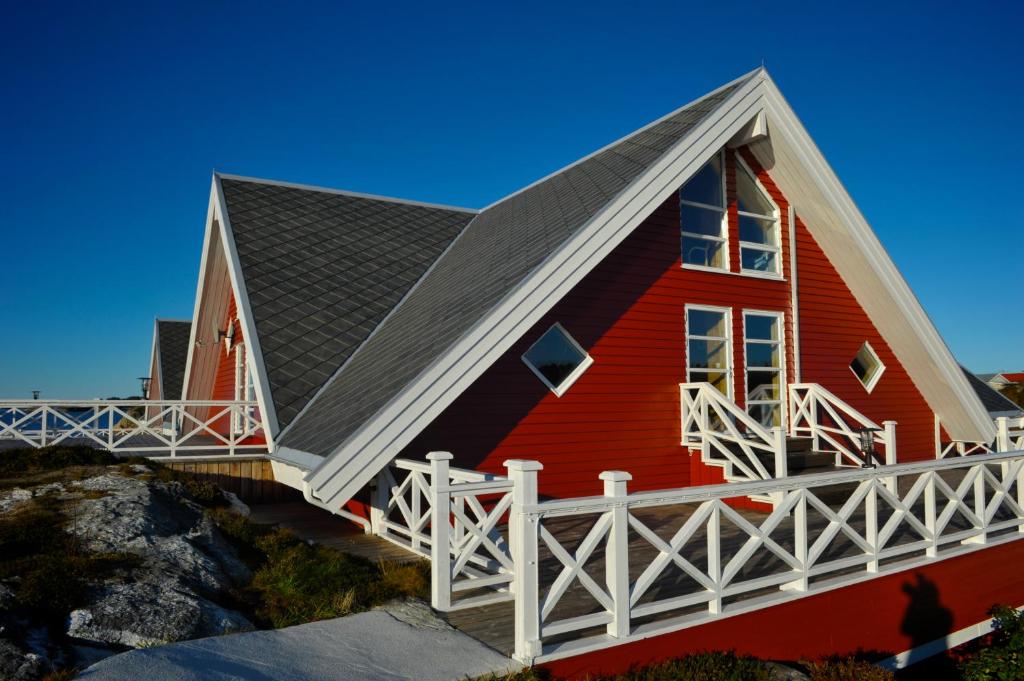 Aurora Suite — A-frame exterior with white terrace railings and entrance steps