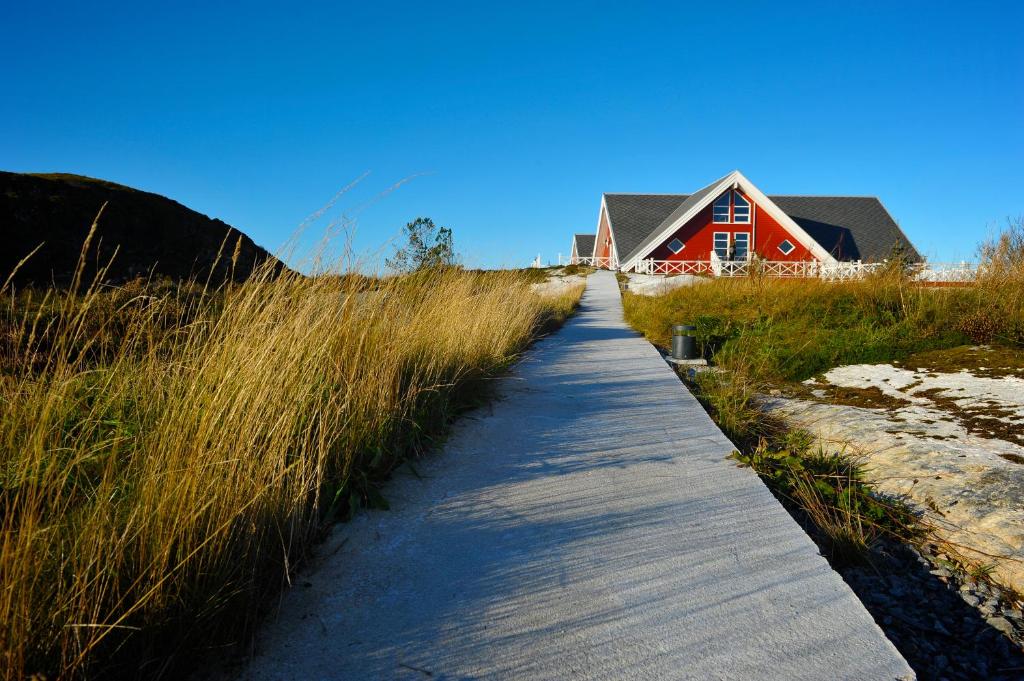 Aurora Suite — path leading to the red A-frame exterior